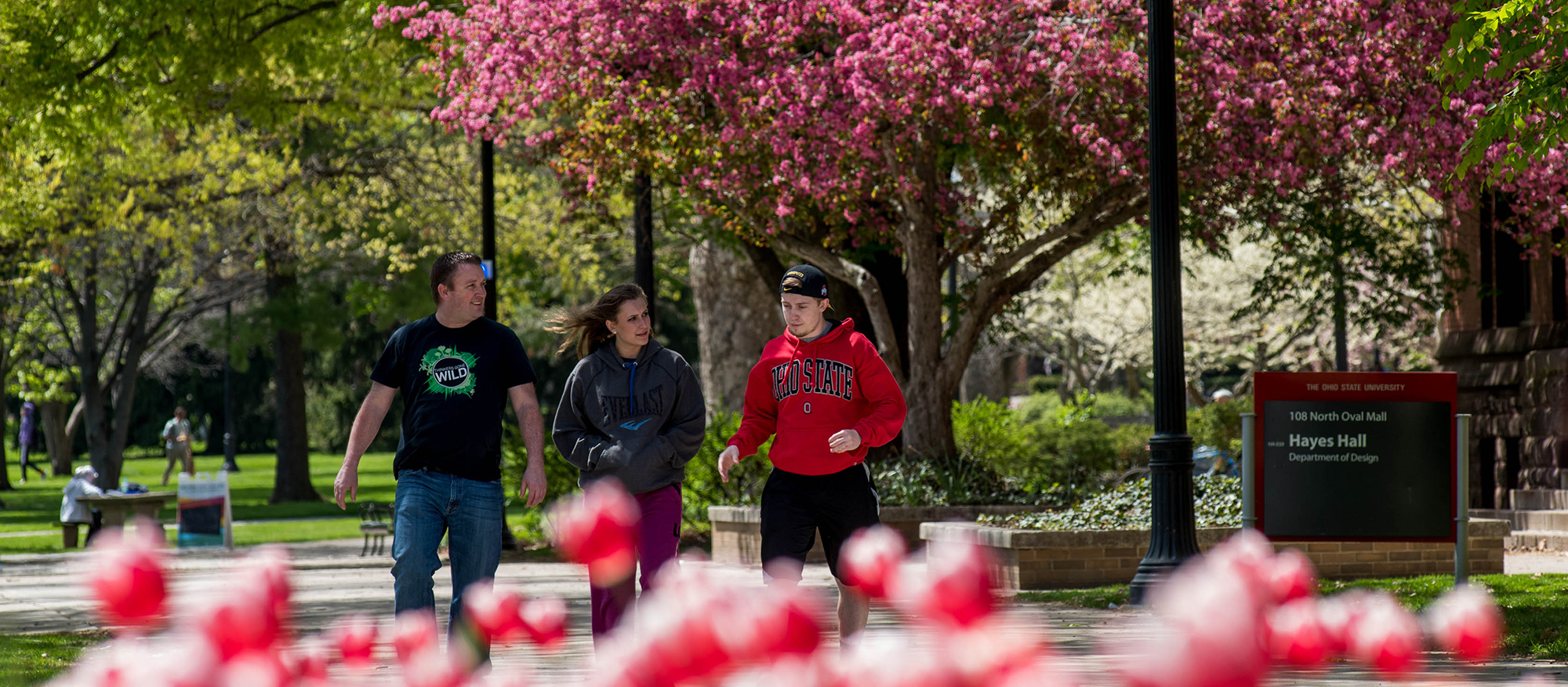 A family walking on the Ohio State University campus